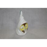 A Royal Worcester bone china owl candle snuffer in the form of an hooded owl caricature, 7.5 cm.