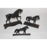 A Victorian black painted cast iron fireside flat back figure modelled as a working horse,