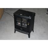 A Dimplex stove form electric heater, 56 cm high.