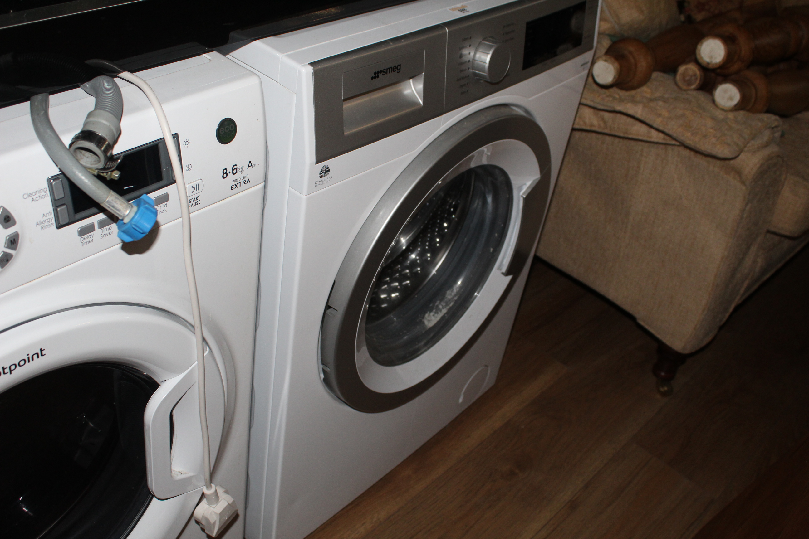A Smeg WHT814LUK A+++ washing machine, 85 cm x 59.5 cm x 52 cm.