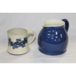 A Wetheriggs pottery jug with blue glaze and cream interior, 12.