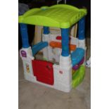 A step 2 child's plastic play house, 105 cm high.