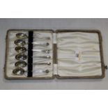 A cased set of six silver teaspoons, each with moulded trefoil surmounts, hallmarks for Birmingham,