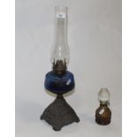A Victorian cast and coloured glass oil lamp,