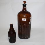 A vintage brown glass poison bottle with fluted base section, complete with stopper, 33 cm high,