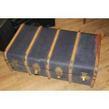 A ribbed travel trunk with blue canvas covering and bentwood ribs, 31 x 90 x 51 cm.