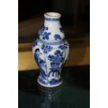 An early 20th century Chinese blue and white porcelain miniature baluster vase with lobbed sides,