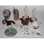 A mixed box of decorative pottery and resin ornaments, including a German metal lidded stein.