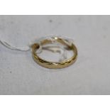 An 18ct gold ring, with repeating design. Marked .750, ring size L, weight 3.2 grams.