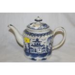 A 18th/19th century Delft pottery teapot decorated with a pagoda design, 14 cm.
