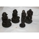 Four Heredities bronzed resin figures - two of seated girl wearing wide rim hats,