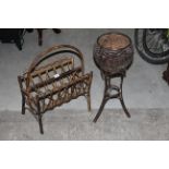 A painted rattan three division magazine rack with curved handle,