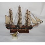 A scratch built painted wood model galleon on stand,