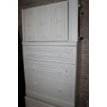 A modern six piece white laminate bedroom suite, comprising a double door wardrobe,