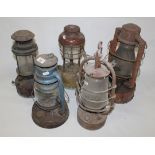 A group of 5 vintage tilly lamps.