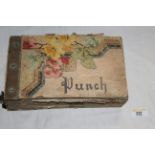 An early 20th century brown leather cloth J D L S Wallpaper sample album, "Punch", 26 cm long.