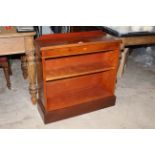 A modern reproduction yew wood open bookcase with shallow raise back above a moulded oblong top.
