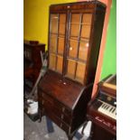 A 1920's walnut bureau bookcase with astragal glazed doors on cabriole legs,