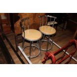 A pair of modern chrome effect and beech wood bar stools, 97 cm high with seat height of 73 cm.