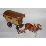 A pottery and plywood "Gypsy caravan group" 69 cm long.