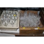 Three boxes of various glassware including wine glasses, sherry glasses and tumblers.