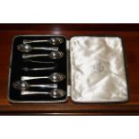 A cased set of six silver teaspoons and sugar tongs, hallmarks for Birmingham maker Elkington & Co,