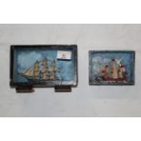 Two miniature model ships contained in painted display cases,