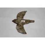 A pale green glazed art pottery plaquew of a swallow in flight,