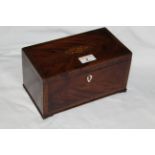 A George III figured mahogany rectangular tea caddy,