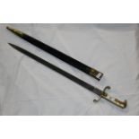 An early 19th century French artillery short sword with brass hilt and etched blade,