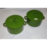 A pair of pea green glazed pottery lidded casserole dishes. 26 cm wide x 18 cm high.