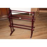 A modern stained wood towel rail of traditional form, 77 x 71 cm.