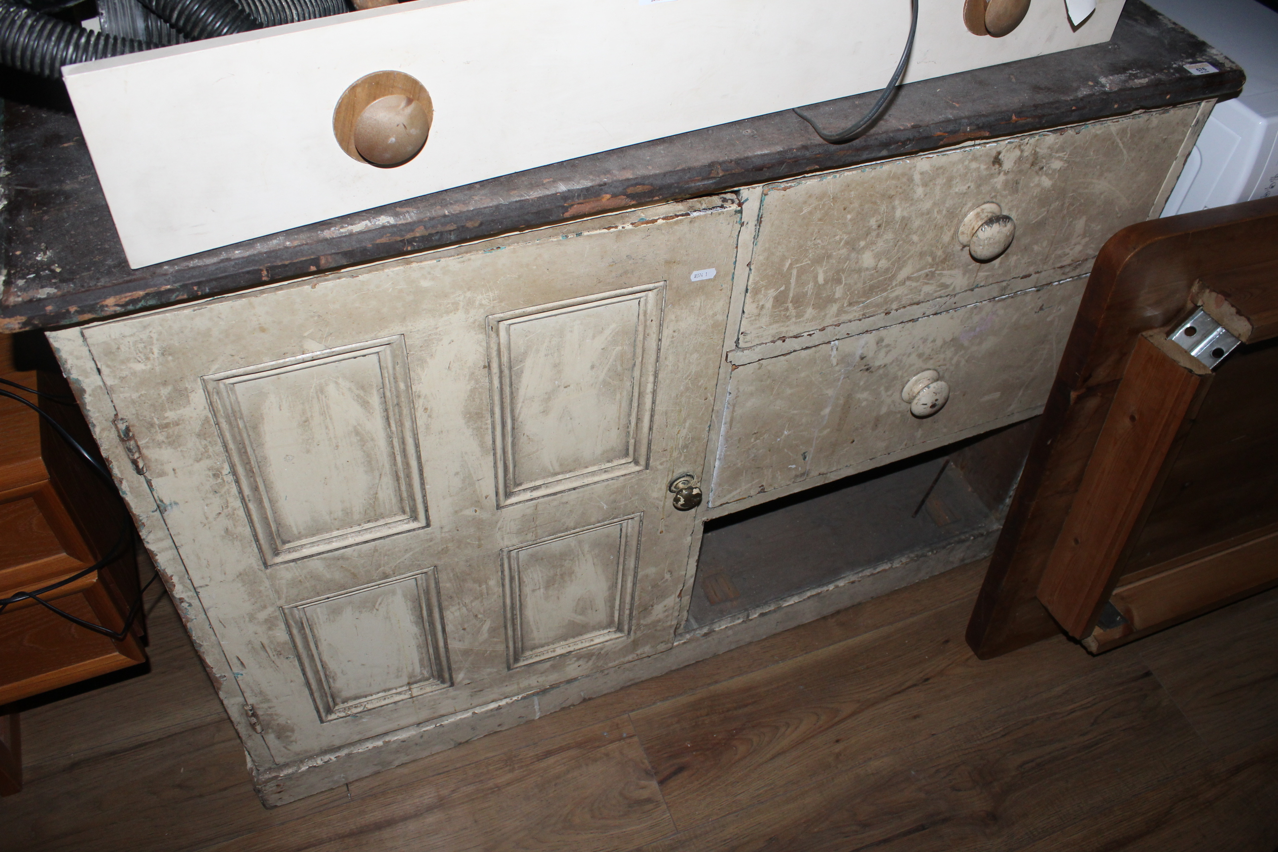 A Victorian cream painted pine cupboard,