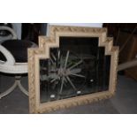 A gilt framed rectangular wall mirror with five division bevelled plate and stepped top,