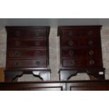 A pair of reproduction mahogany bedside chests,