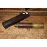 A 19th century leather bound two drawer telescope with leather case, 18 cm overall.