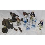 A group of four resin figures in the manner of Border Fine Arts,