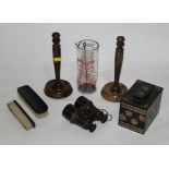 A pair of turned oak candlesticks, a pair of 19th century field glasses,