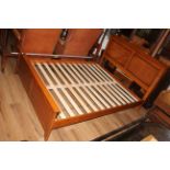 A modern mahogany double bed having a moulded and double panelled headboard,