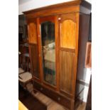An Edwardian inlaid mahogany mirror door wardrobe,