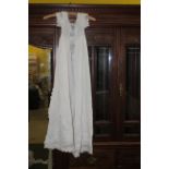 An antique cotton and lace garment, most probably a christening gown,