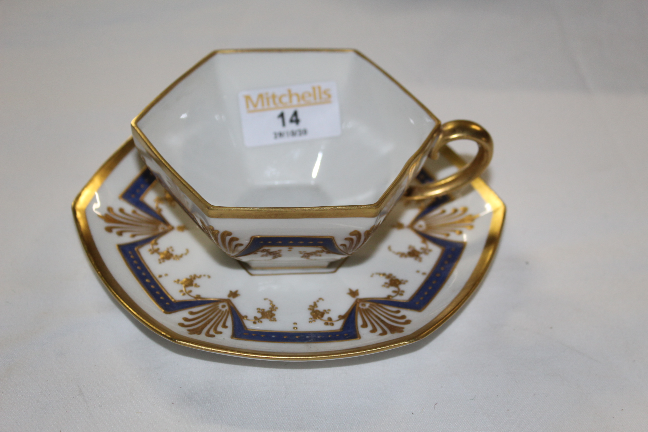 An early 20th century Limoges porcelain cabinet cup and saucer,