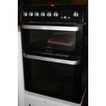 A Hotpoint Ultima electric cooker, 59 cm wide.