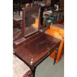 A Late Victorian stained pine dressing table, the rectangular mirror with shaped cresting,