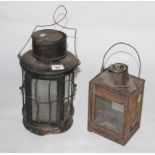 Two vintage metal lanterns, height 32 cm and 25 cm respectively.