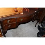 A figured walnut serpentine fronted dressing table, fitted 5 drawers on cabriole legs,