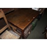 A Victorian oak rectangular kitchen table, the top with later applied edging on turned legs,