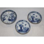 A group of three Chinese export blue and white saucer dishes,