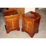 A pair of reproduction yew wood bedside cabinets,