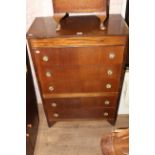 A 1950's utility oak veneered chest of drawers, 75 x 42 x 107 cm high.